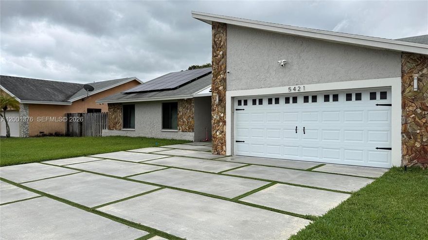 Beautifully remodeled 4-bedroom, 2-bath waterfront home with canal views and no rear neighbors. Fully updated in 2021 with new roof, modern kitchen, updated bathrooms, and upgraded finishes throughout.

Spacious layout with high ceilings and recessed lighting. Large driveway fits 6+ vehicles plus a 2-car garage. Separate AC units in garage and master bedroom.

Enjoy a 62 ft covered and tiled patio overlooking the canal with relaxing water views.

Solar panels are installed and help keep electric costs low

Conveniently located near schools, shopping, and major roads.