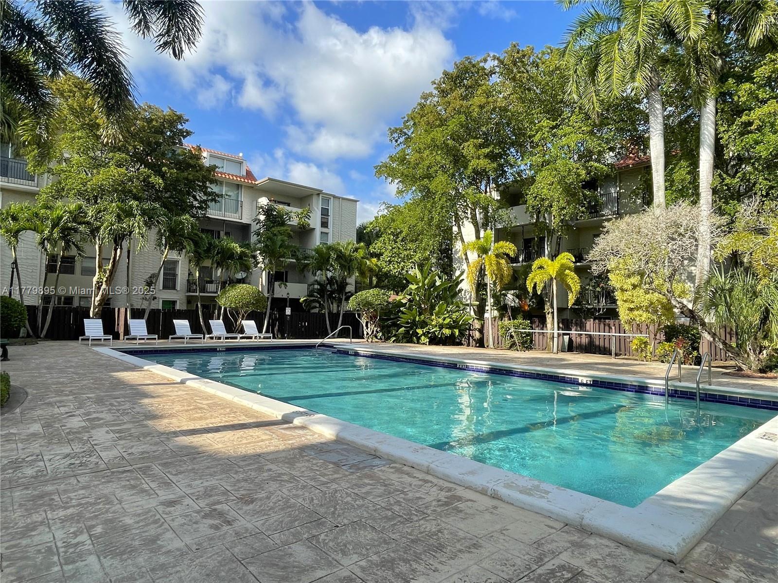 Beautiful 1/1 residence with private patio garden area on first floor of gated community, with direct access to pool area. Lush greenery abounds in this tranquil Pinecrest community. Tile floors, walk-in closet, large living area, & 1 unassigned parking space included. Gas stove (gas included with rent). Close to Trader Joes, Walgreens, Metrorail train station, and Dadeland Mall. Laundry rooms in building. Available starting June 17, 2025