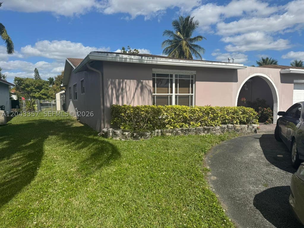 Photo of 9451 NW 20th Pl, Sunrise, FL 33322 (MLS # A12043357)
