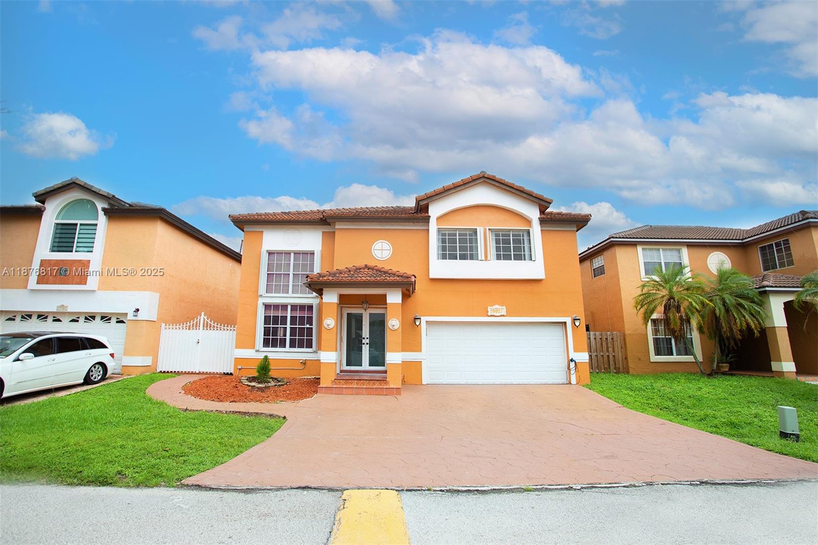 Opportunity 2-story home in the gated Marbella community featuring 5 bedrooms and 4 bathrooms, plus a 1/1 efficiency that can be subleased or used by tenants. Step into soaring volume ceilings with elegant chandeliers, a formal living and dining room, and an updated kitchen with breakfast nook open to a spacious family room. One bedroom with private entrance is on the first floor. Upstairs, the large master suite includes a walk-in closet, jacuzzi, and separate shower. Wood floors throughout, 2-car garage, fenced backyard with covered patio, and communal play yard next door. Prime location near I-75, Palmetto, shopping, dining, and entertainment.