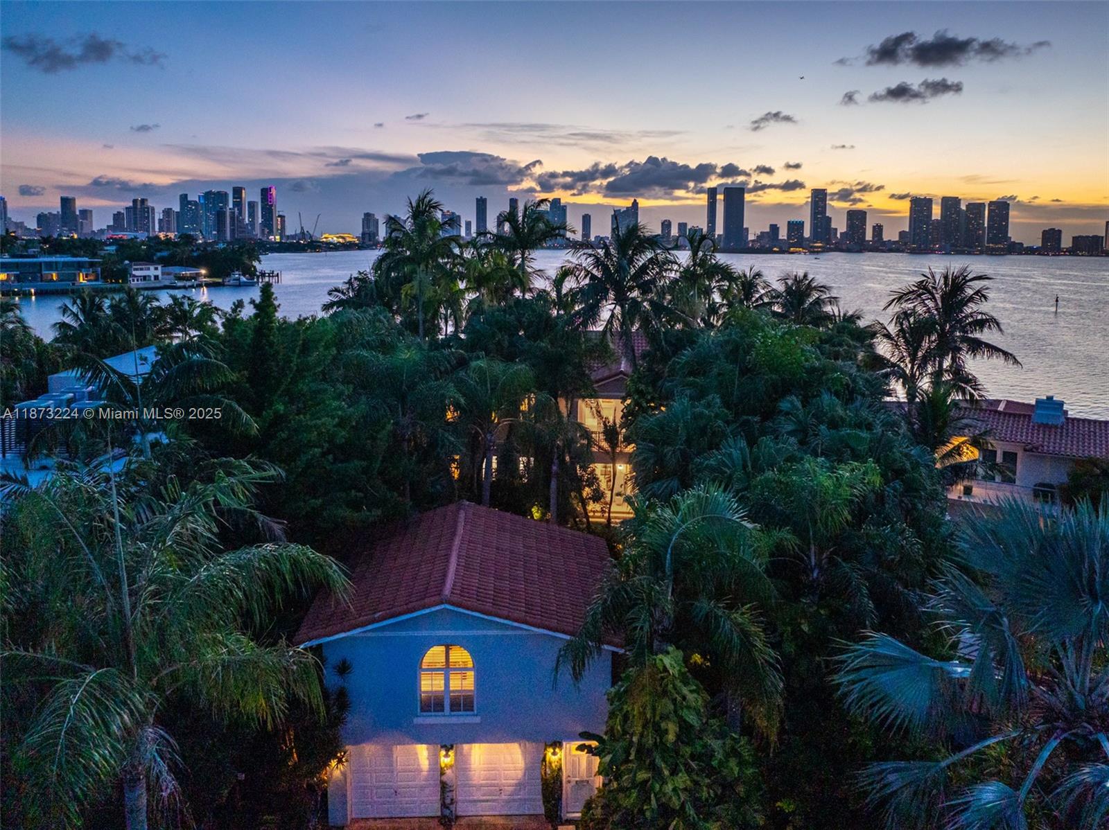 Experience the ultimate Miami Beach lifestyle, located on the prestigious Venetian Islands. This beautifully updated residence offers the perfect blend of modern luxury and classic charm, featuring spacious open living areas, high ceilings, and an abundance of natural light throughout.
Enjoy a chef’s kitchen with top-of-the-line appliances, generous bedrooms with en-suite baths, & seamless indoor–outdoor flow to a lushly landscaped backyard. The private outdoor space boasts a sparkling pool, multiple lounge areas, and stunning views—ideal for entertaining or relaxing in your own tropical oasis.
Perfectly situated just minutes from Sunset Harbour, Lincoln Road, and the beaches, with easy access to world-class dining, shopping, & nightlife while maintaining a serene, residential feel.