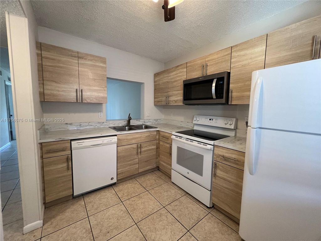 Photo of 21954 Tidewater Ter #107, Boca Raton, FL 33433 (MLS # A11756575)