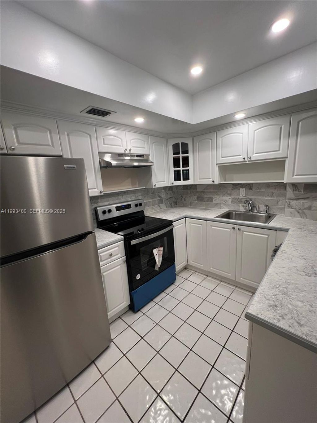 Photo of 2605 NW 47th Ter #103, Lauderdale Lakes, FL 33313 (MLS # A11993480)