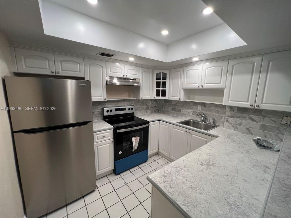 Photo of 2605 NW 47th Ter #103, Lauderdale Lakes, FL 33313 (MLS # A11993480)