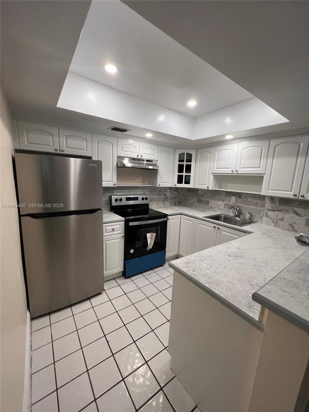 Photo of 2605 NW 47th Ter #103, Lauderdale Lakes, FL 33313 (MLS # A11993480)