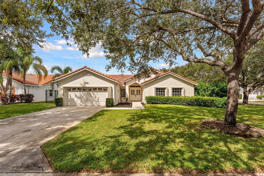 Step inside and be WOWED by this stunning chef’s kitchen—an entertainer’s paradise featuring a statement island with wine cooler, quartz countertops, sleek stainless steel appliances, extractor hood, and a convenient butler pantry/laundry room. This 4-bedroom, 2-bath home boasts high vaulted ceilings, wood tile floors, warm modern finishes, and a beautifully remodeled guest bathroom. Enjoy peace of mind with a BRAND-NEW ROOF (2024) and A/C (2020). The primary suite offers an oversized walk-in closet plus a second closet. Outside, enjoy a cozy enclosed space and a separate outdoor patio—perfect for gatherings. Complete with a 2-car garage and large driveway on a spacious 10,021 sqft corner lot. Ideally located near parks and The Walk with great shopping and dining options. Low monthly HOA!
