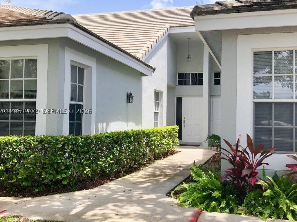 Photo of 8723 Forest Hills Blvd, Coral Springs, FL 33065 (MLS # A12051403)
