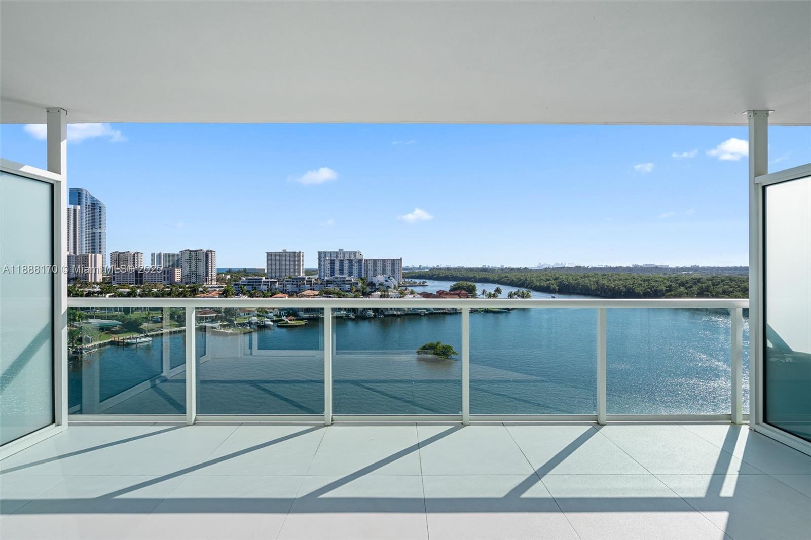 Luxury Living at 400 Sunny Isles! Step into elegance with this stunning 3 bedroom / 2 1/2 bath flow through residence. Enjoy breathtaking water views from every window! You will enjoy Sunrises and Sunsets! This spacious unit features floor-to-ceiling windows, an open concept layout and top of the line finishes through out. The modern kitchen is equipped with high end appliances and European cabinetry, perfect for both everyday living and entertaining. Located in a premier waterfront community and five-star amenities, including a state of the art fitness center, infinity edge pool, spa, tennis courts, and 24 hour bellman! Just minutes from the beach, Oleta River State Park and world class shopping and dining at Bal Harbour and Aventura Mall!