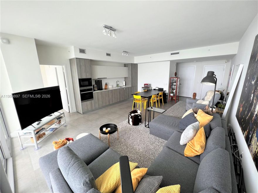 Fully furnished and equipped, desirable line 4, electric blinds, custom built-in closets. Bose system, semi-private elevator. TWO parking spaces, close to the elevator. The owner would consider a pet, with an extra pet deposit. The building offers top-of-the-line amenities, such as: state of the art fitness center, tennis court, 2 gorgeous pools (one is heated), beach club cabanas, waterfront deck, fenced dog park, beach volleyball court, etc. Internet and cable included. Minutes away from Design District, Wynwood, MIA Airport, Midtown, and Brickell. Easy access to I-95, Miami Beach, etc. Ready to move in. Call or text agent for fast response.