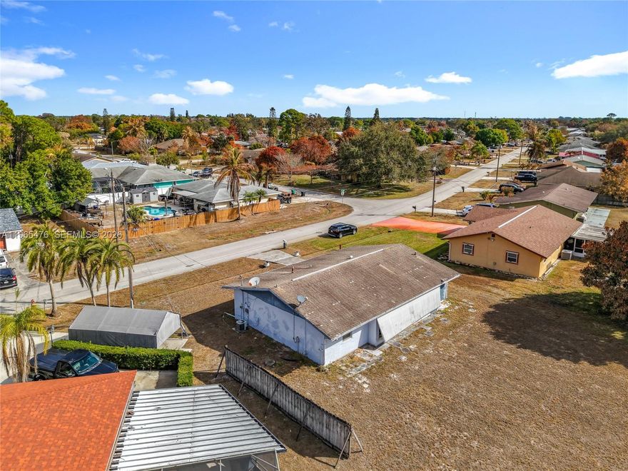 Single-story home set on an oversized 12,197 sq ft lot in Port St. Lucie, offering space, flexibility, and value. Interior features include tile flooring throughout the main living areas and bedrooms, a functional kitchen with generous cabinet storage, and a layout that provides separation between living and sleeping areas for added privacy. The primary suite includes a jetted tub and open bath design. Natural light fills the main living space, and sliding glass doors lead to a large, enclosed patio.
A standout feature is the expansive enclosed terrace, offering space suitable for entertaining, hobbies, or extended living use. The oversized backyard provides room for outdoor activities, storage, or future improvements. This property presents a strong opportunity for buyers looking to update and personalize or for investors seeking lot size and potential in an established neighborhood. Conveniently located near shopping, dining, and major roadways.