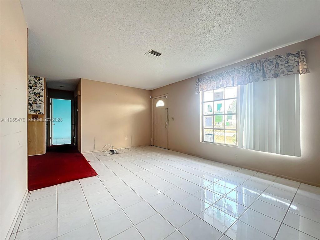 Photo of 310 SE Calmoso Dr, Port St Lucie, FL 34983 (MLS # A11965476)