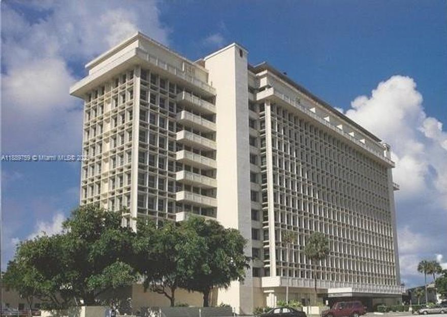 A blank canvas awaits you in this spacious David William condominium, cleared out and ready for your custom design. Large impact windows with solar shades flood the unit with natural light and provide views to The Biltmore Hotel and Coral Gables' majestic treescape. The generous floor plan with large closets can be configured into two bedrooms with plans approved by the Condominium Assoc. An upgraded electrical panel provides increased amperage. Walk to Miracle Mile, Venetian Pool, golf courses, and trolley. Close to UM and MIA Airport. An impeccably maintained building features attentive, professional staff. Ongoing enhancements include new rooftop pool, waterproofing, and exterior upgrades. 50-year Certification progresses now. Covered deeded parking space included!