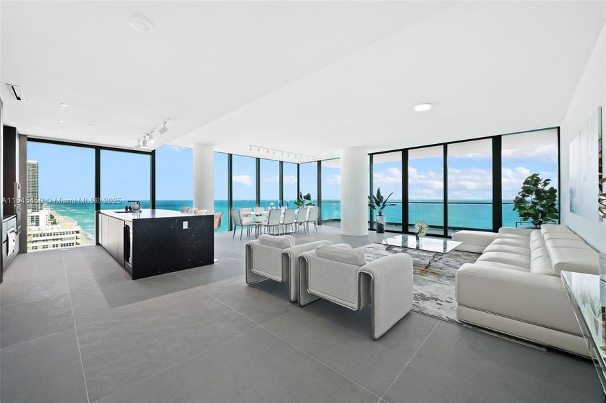 This high half floor 3 BR + den, 3 1/2 bath home clears all adjacent buildings for views from Ocean to Intracoastal.  Interiors by Minotti  w/Boffi kitchens & Gaggenau appliances & finished w/large slab natural stone flooring, cove lighting & pre-wired for smart home features. Primary Bedroom w/finished WIC built by B&B Italia.  Floating bathtubs, Dornbracht, Duravit and Blu Bath fixtures & accessories. 2,913 SF interior space + 475 SF balconies.