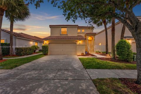 Photo of 15657 NW 12th Mnr, Pembroke Pines, FL 33028 (MLS # A12023279)
