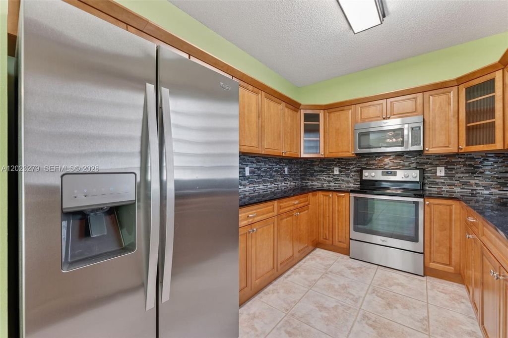 Photo of 15657 NW 12th Mnr, Pembroke Pines, FL 33028 (MLS # A12023279)