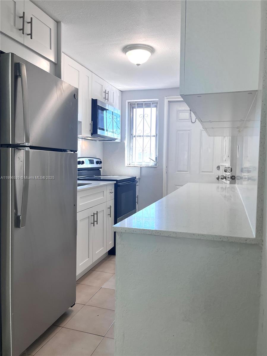 CORAL GARDENS CONDO BLDG - Residential Lease