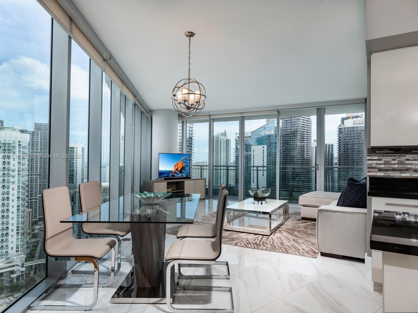 Experience refined living in this fully furnished three-bedroom, three-bath corner residence with sweeping views of the Miami River and Brickell skyline. Two of the bedrooms feature en-suite baths, while a third full bath is conveniently located off the hallway. Specially curated furnishings, designed for comfort and ease. Enjoy the wraparound corner floor-to-ceiling glass windows that invite natural light and stunning panoramas. Ideally situated within walking distance to Brickell’s global financial district, world-class dining, and cultural offerings - this residence is perfect for those who appreciate a vibrant yet serene lifestyle. Spa-like amenities. 24-hour front desk attendant. One of the best parking spaces in the building.