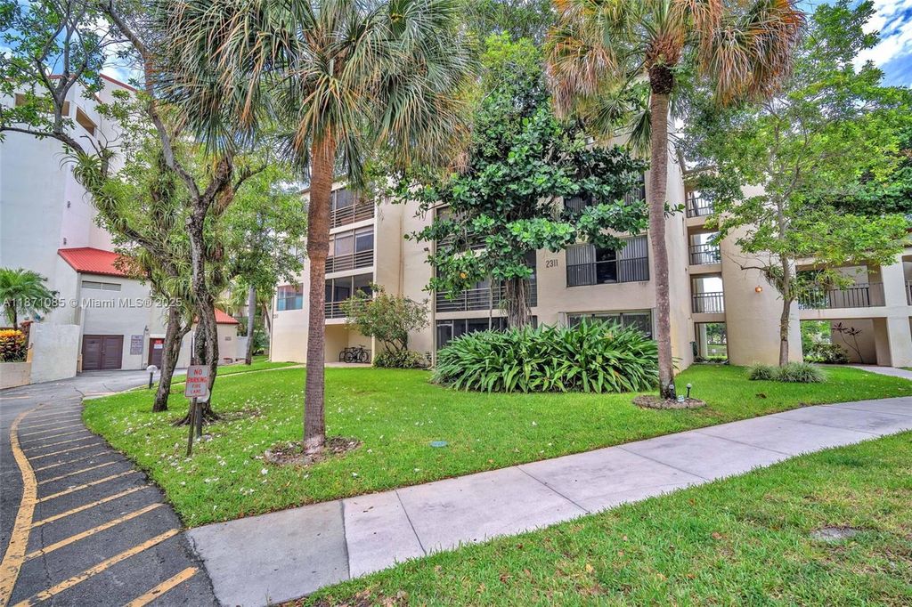 Photo of 2311 S Cypress Bend Dr #316B, Pompano Beach, FL 33069 (MLS # A11871085)