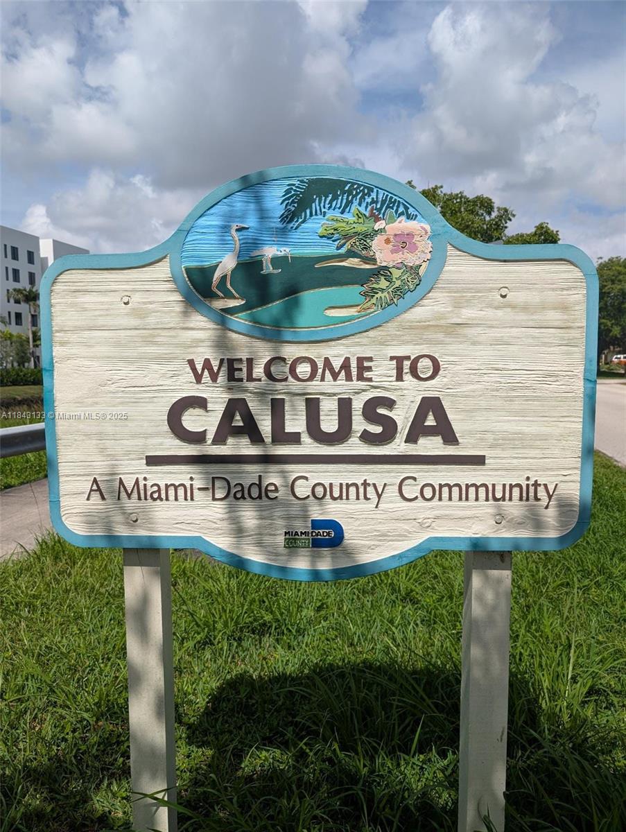 Charming corner-lot home in Calusa with 3BR/2BA main house plus a 1BR/1BA converted garage suite—ideal for guests or extended family. Located within walking distance to A+ Calusa Elementary and Calusa Estate Park. Features impact windows/doors, renovated kitchen and bath, and a newer A/C (2022). Enjoy shaded outdoor living under a spacious aluminum patio roof. Yard includes a sprinkler system fed by a well for water efficiency. Extra laundry room offers a brand-new washer, sink, and tankless water heater for on-demand hot water.