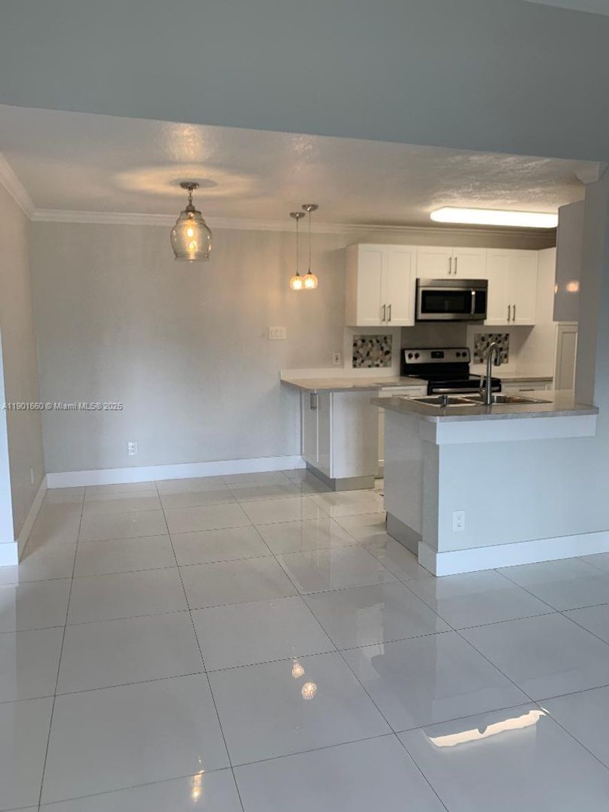 1BED/1BATH beautiful unit. Fully remodeled in very desired Coral Club Garden Villas in The Hammocks. White porcelain floors throughout, updated kitchen. Community offers clubhouse and pool. Gated complex close to shopping center with Publix, restaurants and library. Great Location