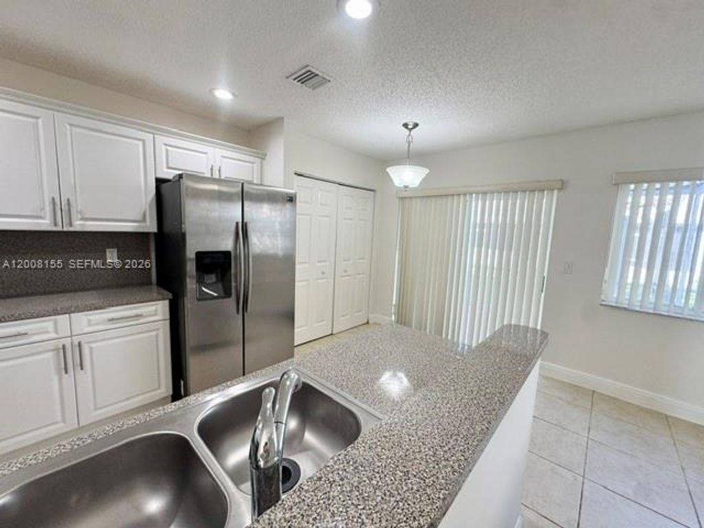 Photo of 833 NW 208th Ter #833, Pembroke Pines, FL 33029 (MLS # A12008155)