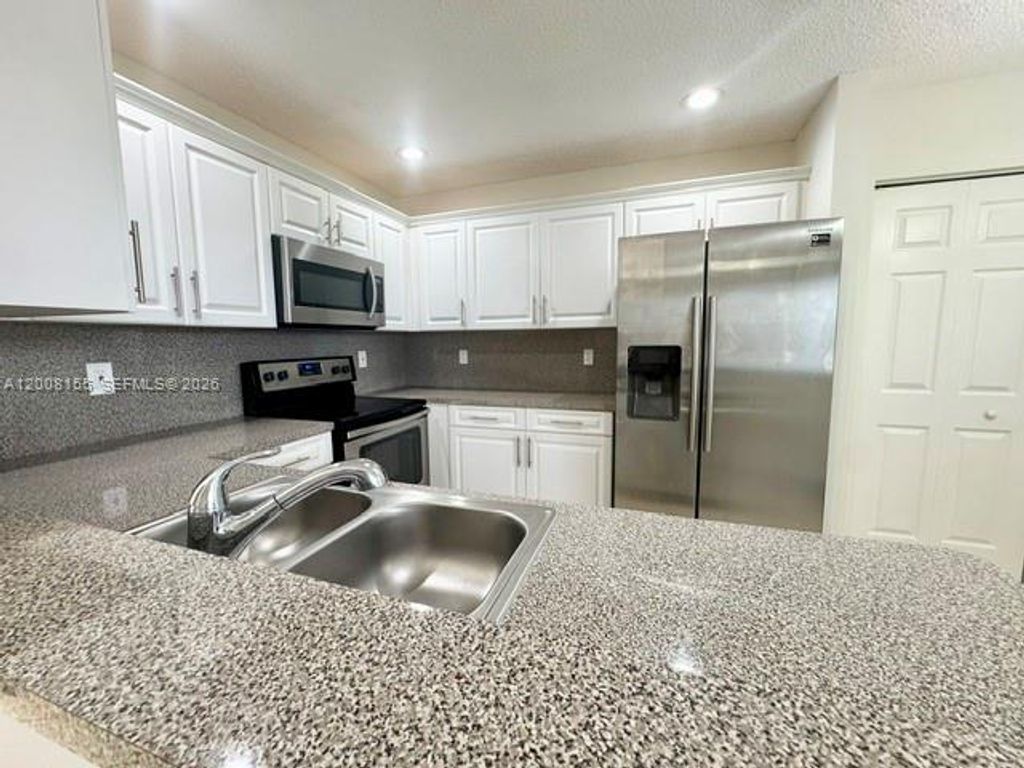 Photo of 833 NW 208th Ter #833, Pembroke Pines, FL 33029 (MLS # A12008155)