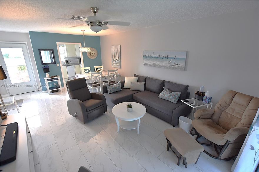 Discover this turnkey, wonderful corner 1/1/1 in Dudley with a water view. It features uniform tile throughout, including the bathrooms, and blackout shades in the master bedroom. The AC and water heater are less than five years old, the electric panel is updated, and the roof was replaced in 2019. The kitchen, stocked and updated in 2018, awaits you. Savor your coffee with a water view on the screened-in patio.