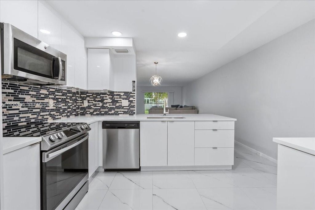 Photo of 2303 Lucaya Ln #E2, Coconut Creek, FL 33066 (MLS # A11925899)