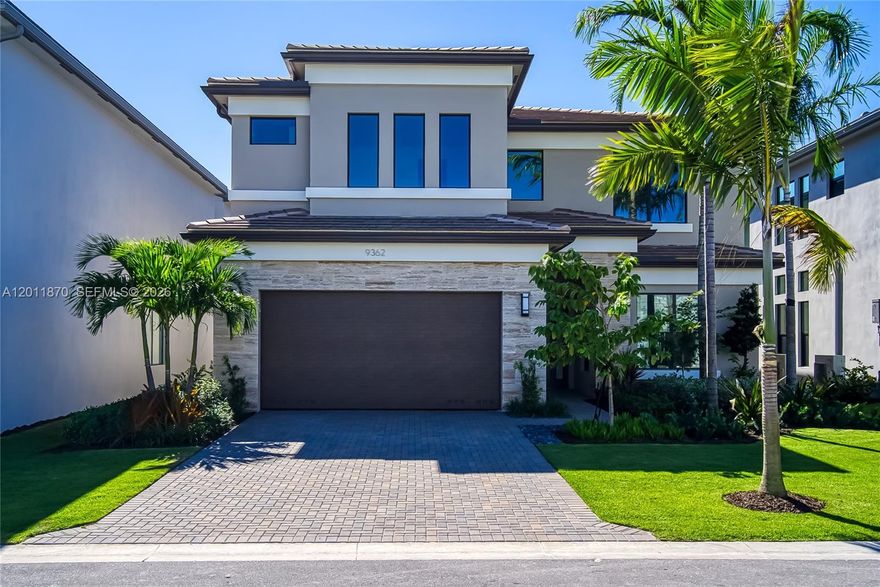 This is the house you have been looking for: end of the street, quite location, never lived in, lakefront, brand new. A rare opportunity to own a waterfront home in one of Boca Raton’s newest and most prestigious communities—offering an exceptional combination of modern design, privacy, scenic views, and full resort-style amenities. This newly built, contemporary two-story residence is located at 9362 Tulip Leaf Ct in the exclusive luxury community of Lotus Edge, Boca Raton. The home features a spacious 5-bedroom / 5-bathroom layout with 3,876 sq ft of living space, including a large modern kitchen with stylish cabinetry, granite countertops, stainless steel appliances, expansive walk-in closets, and sleek, contemporary bathrooms with dual vanities and glass-enclosed showers. Ideally situated in the central part of the community and set directly on the water, the property offers beautiful pond and resort-center views from the backyard, creating a serene and private outdoor setting. The impressive resort center includes multiple swimming pools, a jacuzzi, state-of-the-art fitness center, yoga lawn, lighted tennis courts, pickleball and padel courts, as well as an on-site bar and restaurant. Conveniently located near The Somerset Shoppes (Glades & Lyons) and Olympic Heights Community High School, offering both lifestyle and accessibility.