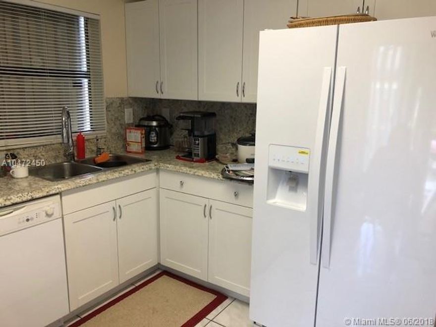 This Great One Story Corner Townhouse 2 Bedroom and 1 Bathroom in the Wonderful Woodgate Community at Kendall Won't Last. 6 Months Old  Renovated Kitchen. Updated Wood Open Porch and Fences. Large Patio. Low Maintenance Monthly  Homeowner Association $ 118.00. Two parking Spots and  Plenty  Guess Parking . Amenities include Pools, Tennis Courts and More. Must See.