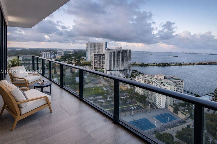 Stunning 24th-floor residence offering breathtaking bay and skyline views from every angle. Perfectly located in the heart of Edgewater, just minutes from the Design District and Downtown Miami. This spacious 3-bedroom, 2-bath home features a wraparound balcony ideal for enjoying Miami’s sunrises and sunsets. The building delivers a true resort-style lifestyle with multiple pools, a rooftop deck with panoramic city views, spa and wellness areas, fitness center, entertainment spaces, and full-service amenities including 24-hour concierge, valet parking, and security.