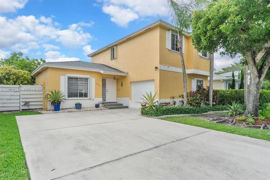 Charming 2-story single-family home on a quiet West Kendall circular street. This bright, sun-drenched property features wood and tile flooring, crown molding, a cozy family den, and a formal dining room with direct outdoor access. The pristine kitchen boasts stainless steel appliances, white cabinetry, a tiled mosaic backsplash, and a breakfast bar. Upstairs, find a spacious primary suite and versatile guest bedrooms/home office. The highlight is a private, fully-fenced tropical backyard with a paved patio, lush lawn, and gorgeous landscaping. Minutes from top schools, parks, and London Square shopping!