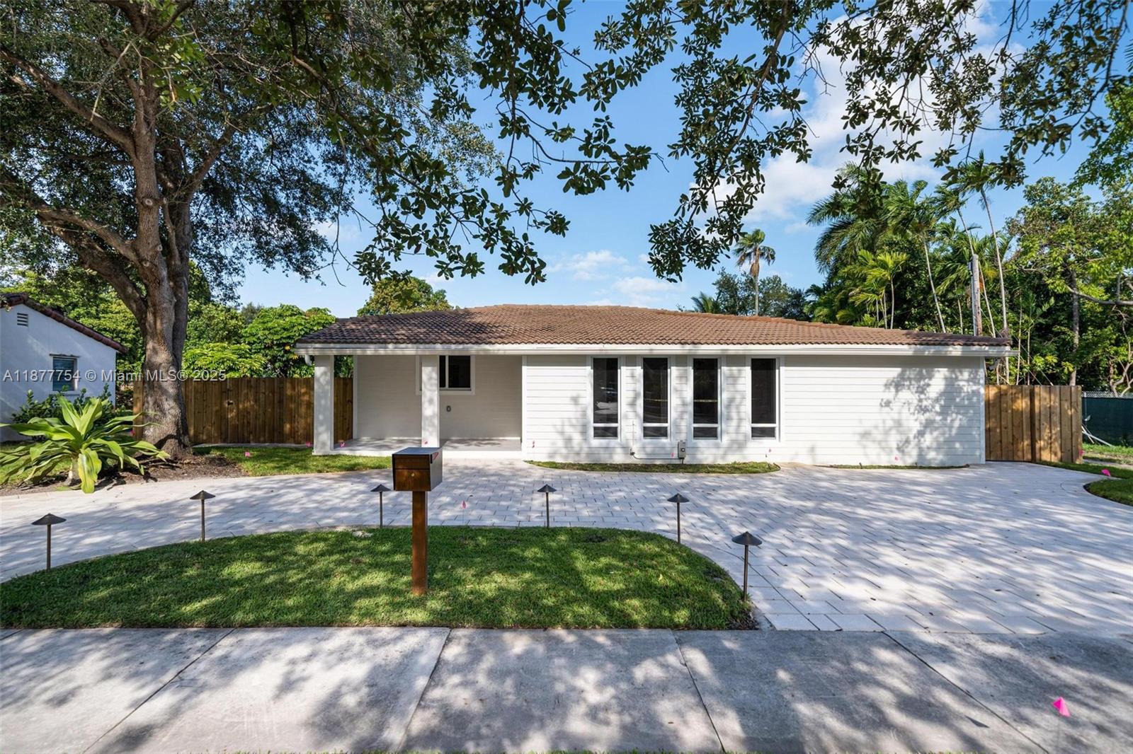 Miami Springs - fully remodeled 4 bed/4 bath home with income potential. This versatile and beautifully remodeled 2023 home in the heart of Miami Springs offers both comfort and opportunity. Featuring 4 bedrooms and 4 bathrooms, two of which are private en-suites with separate entrances, the property is ideal for multigenerational living or income-producing possibilities.The residence boasts hurricane impact windows and doors, new flooring, and a spacious open-concept living room with soaring cathedral ceilings. A stunning backyard deck stretches over 40 feet, perfect for entertaining, while the upgraded kitchen comes equipped with sleek, modern appliances.Enjoy the small-town charm of Miami Springs along with top-rated schools, close proximity to Miami International Airport and Golf Club.