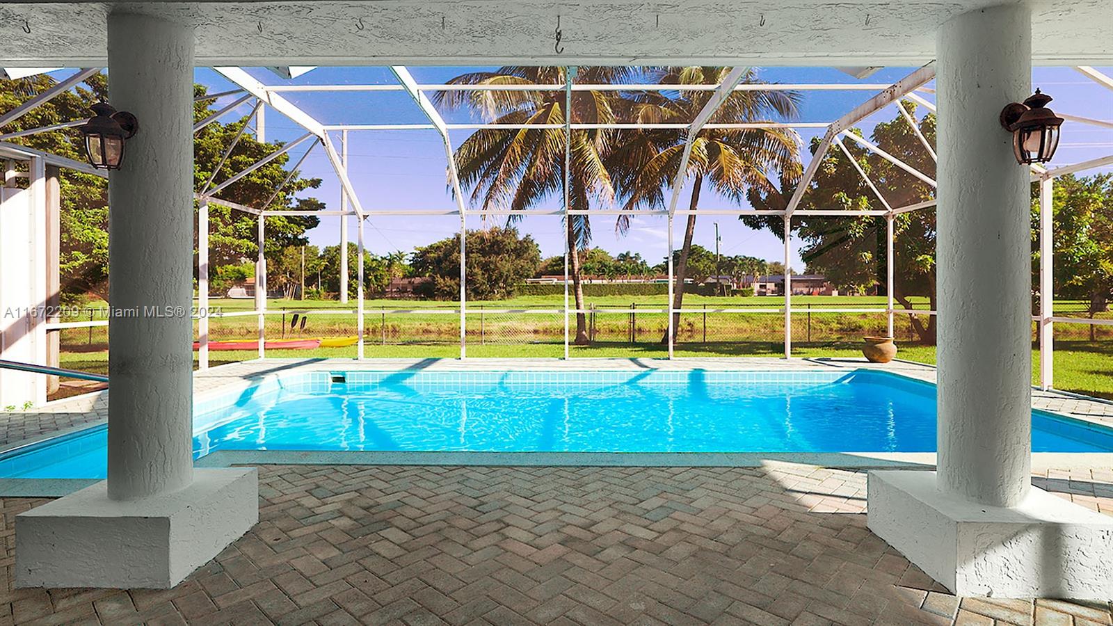 Welcome to your peaceful waterfront retreat in North Palmetto Bay. The pristine canals offer miles of boating, world class fishing, and native wildlife, take a stroll to Coral Reef Park, or enjoy your enormous yard with a screened patio and dream pool. Split plan with two large primary suites and two additional bedrooms. Extra large air conditioned two car garage with a bonus bathroom. Updated kitchen Quartz countertops stainless steel appliances, metal roof (2020), insulated plumbing (2021), tankless water heater (2022), central AC (2023). A+ school district with Westminster, Palmer Trinity, Howard Drive. The “City of Parks” is the quintessential golf cart community. Boating, fishing, golf carts, top schools, parks, and more with that small town feel. The ideal place for your family.