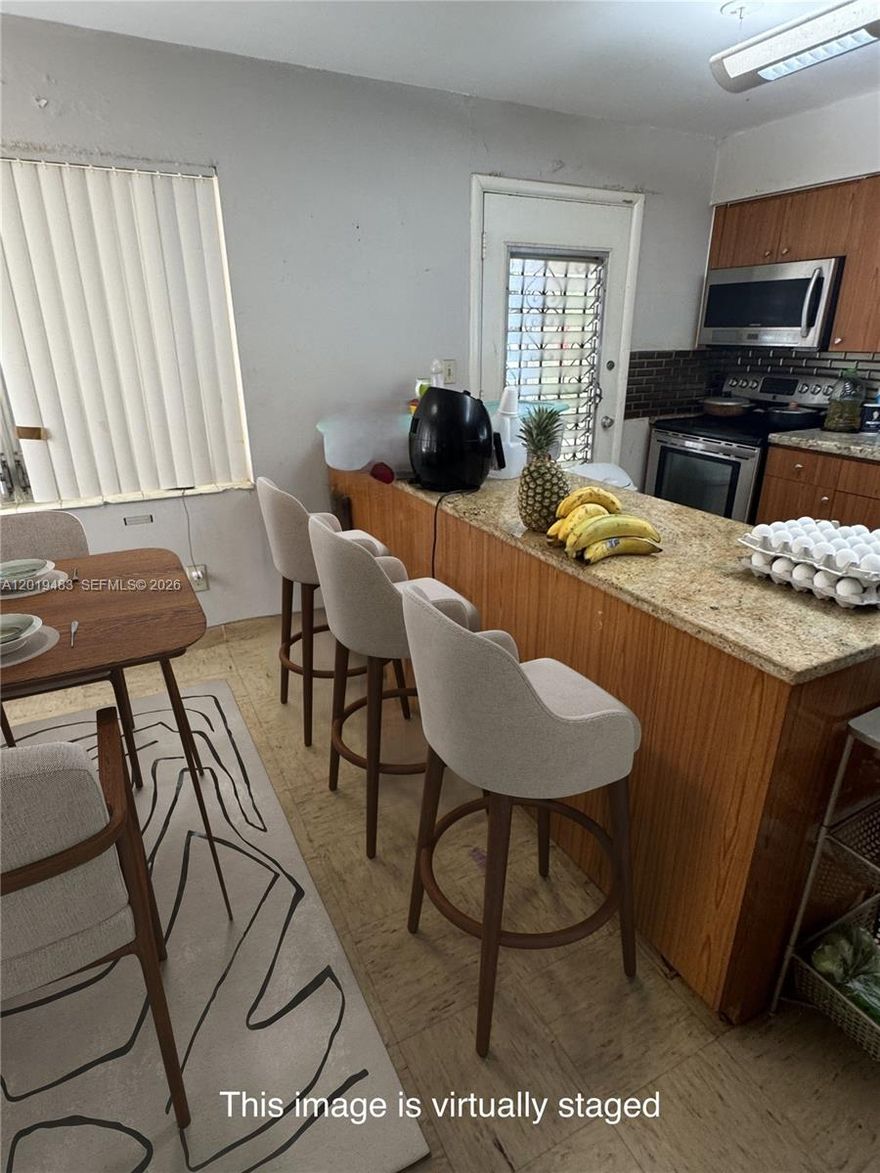 WOW! OPPORTUNITY KNOCKS! This unique home is nestled, amongst the trees on a quiet street in the highly desirable Brentwood area of Miami. Walk to Michelin Star Restaurants, Midtown, Winwood and the Miami Design District or take an easy ride over the causeway to Miami Beach. This once in a lifetime event is Surrounded by New and Ongoing Construction of Multimillion Dollar Mini-Mansions. Enjoy the feel of a serene residential area in the heart of the excitement that is Miami. The current historical home features 3 bed and 2 baths, 1758 Sq.Ft. with a 7,000S Sq Ft. Lot, an open floor plan, travertine tile floors and a new roof. The spacious kitchen offers a center island that opens to the Great Room and includes Granite Countertops and Stainless-Steel Appliances. Perfect for unleashing your creative gourmet side and creating your favorite cuisine.   There are no pet restrictions. Also included are 3 A/C Wall Units and 3 ceiling fans.
HERE COMES THE BEST PART! The Sliding Doors in the Kitchen and Den open up to reveal a spacious yard with a Mini-Olympic Size Swimming Pool and Room for an outdoor kitchen.   Perfect for a swim, barbeque and to enjoy the Florida Lifestyle with family and friends.   The possibilities are endless! Add your personal updates, touches and improvements; Convert the garage or BUILD YOUR DREAM HOME.