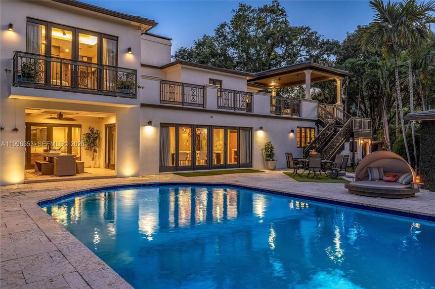 Step into a gated modern estate that delivers the ultimate blend of privacy, design, and resort-style living in one of Miami Shores’ most sought-after locations east of Biscayne. From the moment you enter, soaring ceilings, a dramatic floating marble fireplace, and a wide open layout create an immediate sense of scale and impact, all seamlessly connected to the outdoor living spaces and pool.
The chef’s kitchen is designed to impress and perform, featuring custom teak cabinetry, marble countertops, and a refined breakfast banquette that anchors the space. The primary suite offers a true retreat with grand volume, a private terrace, and a spa-inspired bath that rivals luxury hotels. The outdoor experience is where this home truly stands apart. A 50 ft pool, sauna, expansive lounge areas, and a fully equipped summer kitchen set the stage for unforgettable entertaining. Elevated above it all, a covered lounge with a full wet bar, accessible from both the exterior and second level, delivers a one of a kind vantage point and experience rarely available.



A detached 1 bedroom, 1 bathroom guest house, spacious two car garage, gated side parking, electric vehicle charging, and a Control4 smart home system complete the offering. With rare duplex zoning and a prime east of Biscayne location, this is a unique opportunity that demands to be seen in person.Residense offers gated side parking + AC garage with electric charging station + Control 4 Smart system for the entire home.