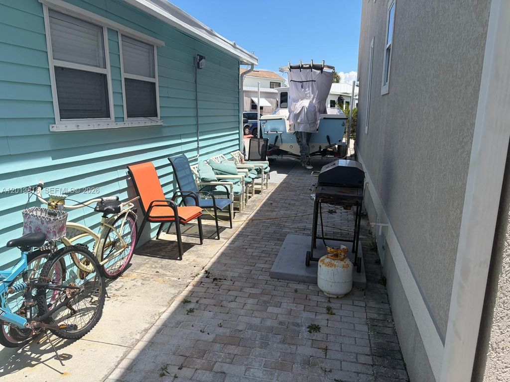 Photo of 979 Nettles Blvd, Jensen Beach, FL 34957 (MLS # A12013816)