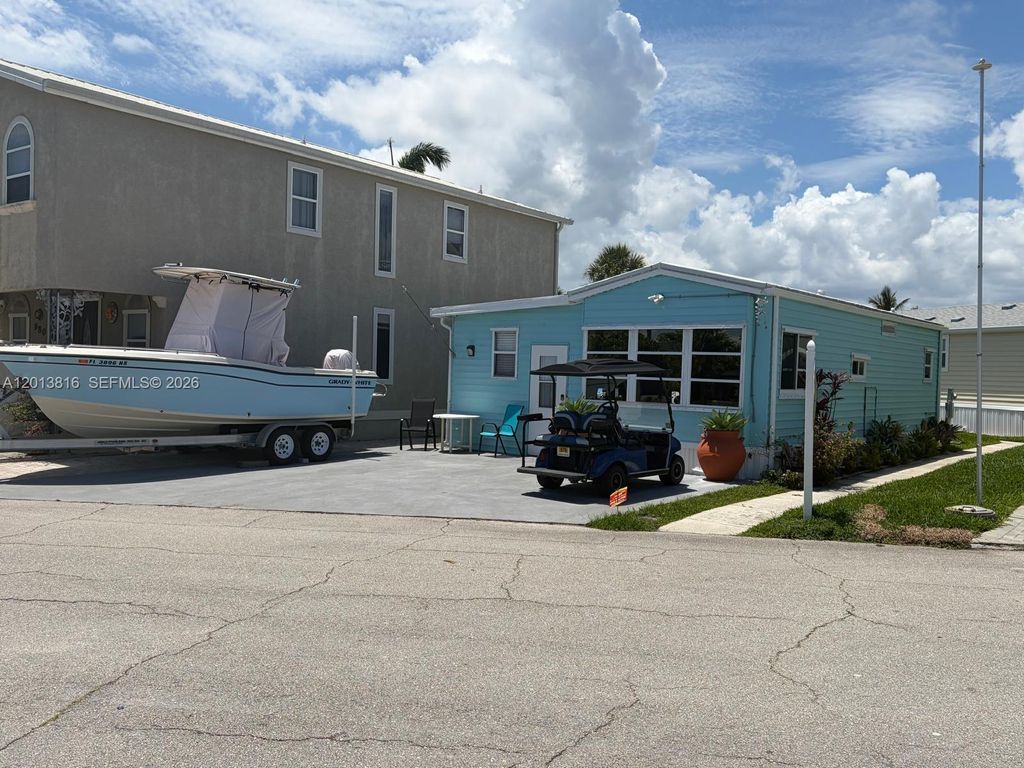 Photo of 979 Nettles Blvd, Jensen Beach, FL 34957 (MLS # A12013816)