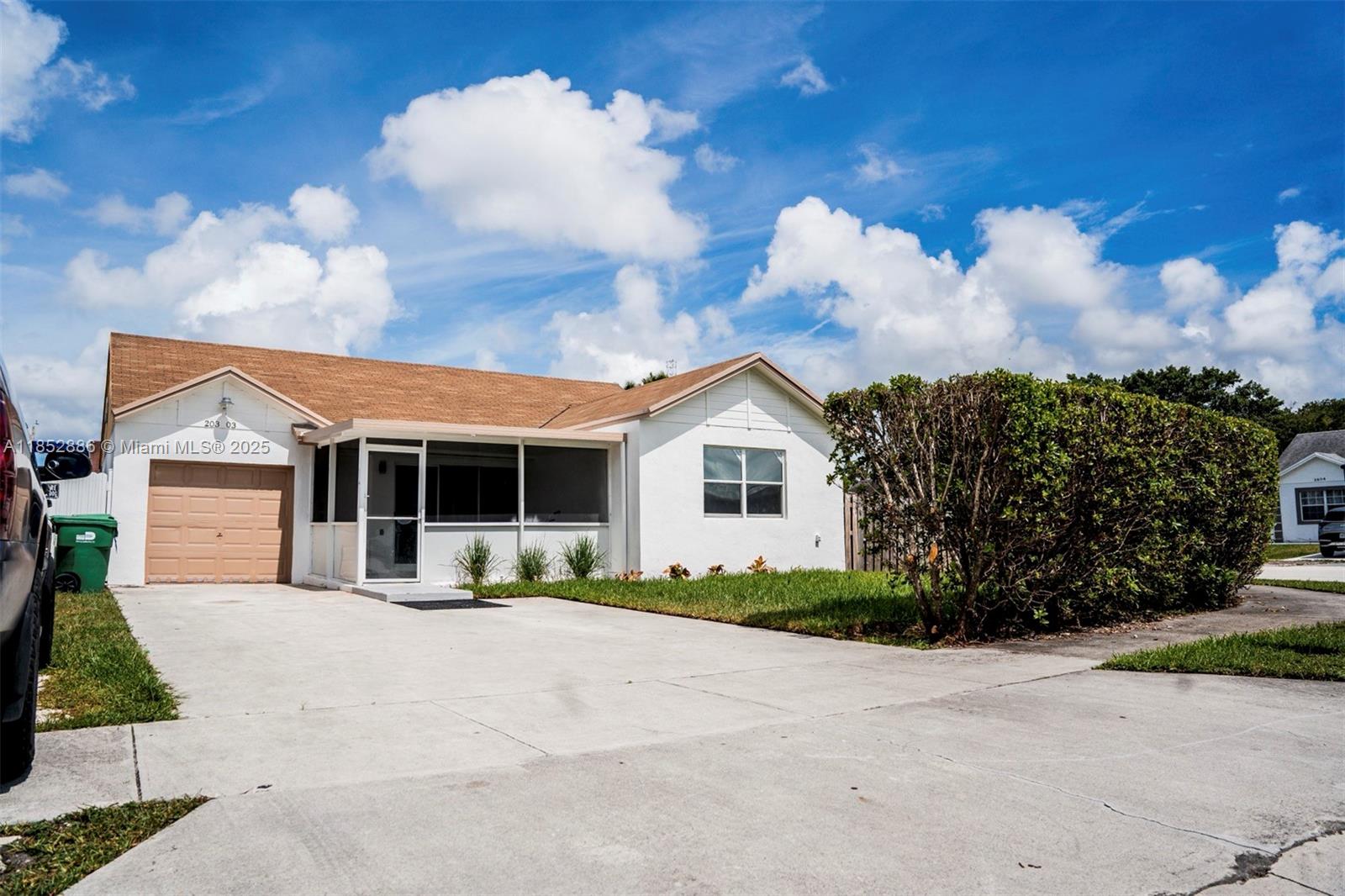 Beautifully renovated 3BD/2BA + den single family home. Just minutes from Hard Rock Stadium, 20 minutes for the beaches, and close to Aventura Mall for shopping. This move-in-ready home features a modern open-concept design, hurricane impact windows, updated central A/C, and brand-new waterproof laminate flooring. Enjoy LED recessed lighting, fresh interior/exterior paint, and ceiling fans in every room. Bathrooms include one with a walk-in shower and one with a tub. The versatile den/office space is ideal for remote work. New plumbing fixtures, security-coded entry, camera system capability, screened-in front patio, private driveway, and fenced backyard.