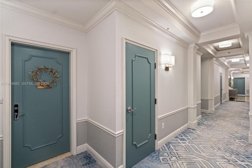 Spectacular Ritz-Carlton penthouse 22nd-floor corner residence offering expansive city views of Coral Gables with partial views of Biscayne Bay. Fully renovated in 2013, this spacious 1,836 SF unit features high ceilings exclusive to the 22nd floor, travertine flooring throughout, recessed lighting, 10" baseboards, and dimmer switches in all rooms. Open living and dining areas include custom built-ins and a kitchen with bar seating. Primary suite offers two walk-in closets, custom wardrobe, and en-suite bath. Separate bedroom/office with en-suite full bath and walk-in closet. One large balcony plus two additional balconies totaling approx. 320 SF. Assigned parking in P2 with EV charging access. Sonos sound system throughout.