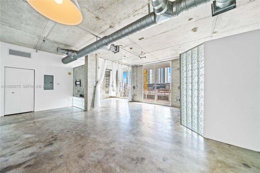 Welcome to contemporary living at The Yorker, a boutique condominium in the heart of Edgewater. This spacious 2-bed/2-bath loft features 10-ft ceilings, polished concrete floors, and abundant natural light. Enjoy a prime location just 15 minutes from Miami International Airport and steps from the new Whole Foods, Trader Joe’s, Midtown, and vibrant cafés. Includes one covered parking space and a storage unit. Low HOA, 2025 SIRS completed, and no upcoming assessments. Qualifies for 5% first-home financing. Surrounded by new luxury towers like Aria Reserve, Villa Miami, and Cove Miami—Edgewater’s transformation is well underway.