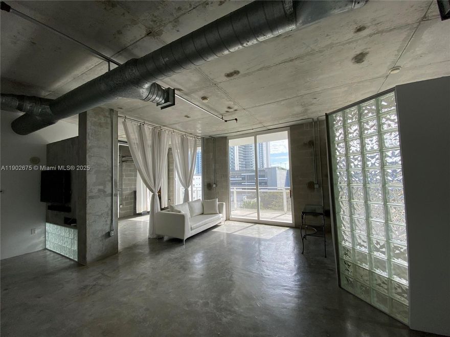 Welcome to contemporary living at The Yorker, a boutique condominium in the heart of Edgewater. This spacious 2-bed/2-bath loft features 10-ft ceilings, polished concrete floors, and abundant natural light. Enjoy a prime location just 15 minutes from Miami International Airport and steps from the new Whole Foods, Trader Joe’s, Midtown, and vibrant cafés. Includes one covered parking space and a storage unit. Low HOA, 2025 SIRS completed, and no upcoming assessments. Qualifies for 5% first-home financing. Surrounded by new luxury towers like Aria Reserve, Villa Miami, and Cove Miami—Edgewater’s transformation is well underway.