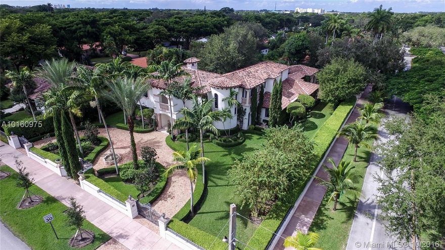 BUILT 2007 :  Villa Alhambra is a property of distinction in the historic section of Coral Gables.    Artisan windows, exotic wood fireplace and spiral hand-crafted staircase are just some of its fine finishes.  Detailed features include Elevator, impact Windows & Doors, motorized chandeliers,  Wet bar with dual temperature wine cooler,  Gourmet kitchen fit for a chef, and Butler’s Pantry and many more.  Designer Lush gardens, perfect setting for resort-style outdoor living, Pool, Spa and Summer kitchen.