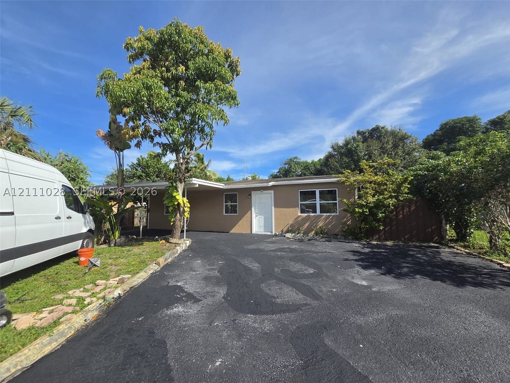 Photo of 5840 NW 41st Ter #5840, North Lauderdale, FL 33319 (MLS # A12111028)