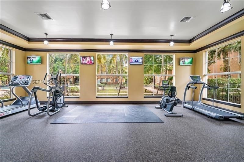 Photo of 8030 N Nob Hill Rd #102, Tamarac, FL 33321 (MLS # A12039991)