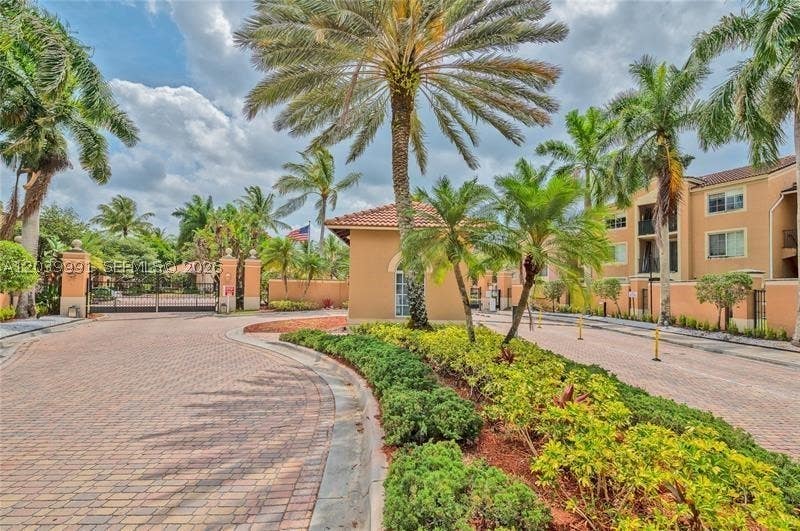 Photo of 8030 N Nob Hill Rd #102, Tamarac, FL 33321 (MLS # A12039991)