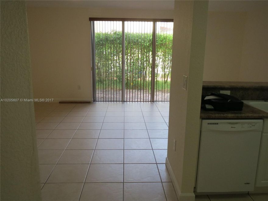 Wonderful Apartment at The Shores on Townhouses area in Isles at Bayshore great community!  Spacious 3 bedrooms/ 2 full bathrooms on first floor. Luminous, nice and useful backyard. Open kitchen with impeccable appliances including Washer & Dryer inside the unit. Separate Storage Room. Community includes a resort style Clubhouse, swimming pool, Gym, Playground, Security Gate. Great location close to Black Point Marina, Schools, Shopping and Parks! Easy to show! Ready fore occupancy!