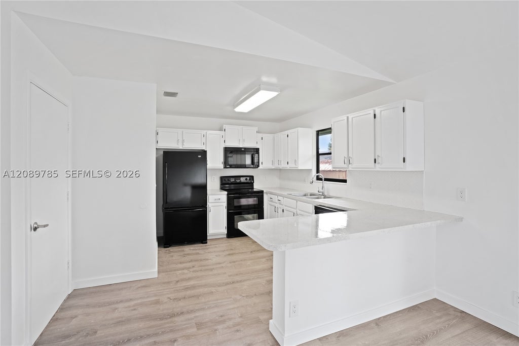 Photo of 6043 Felter St, Jupiter, FL 33458 (MLS # A12089785)