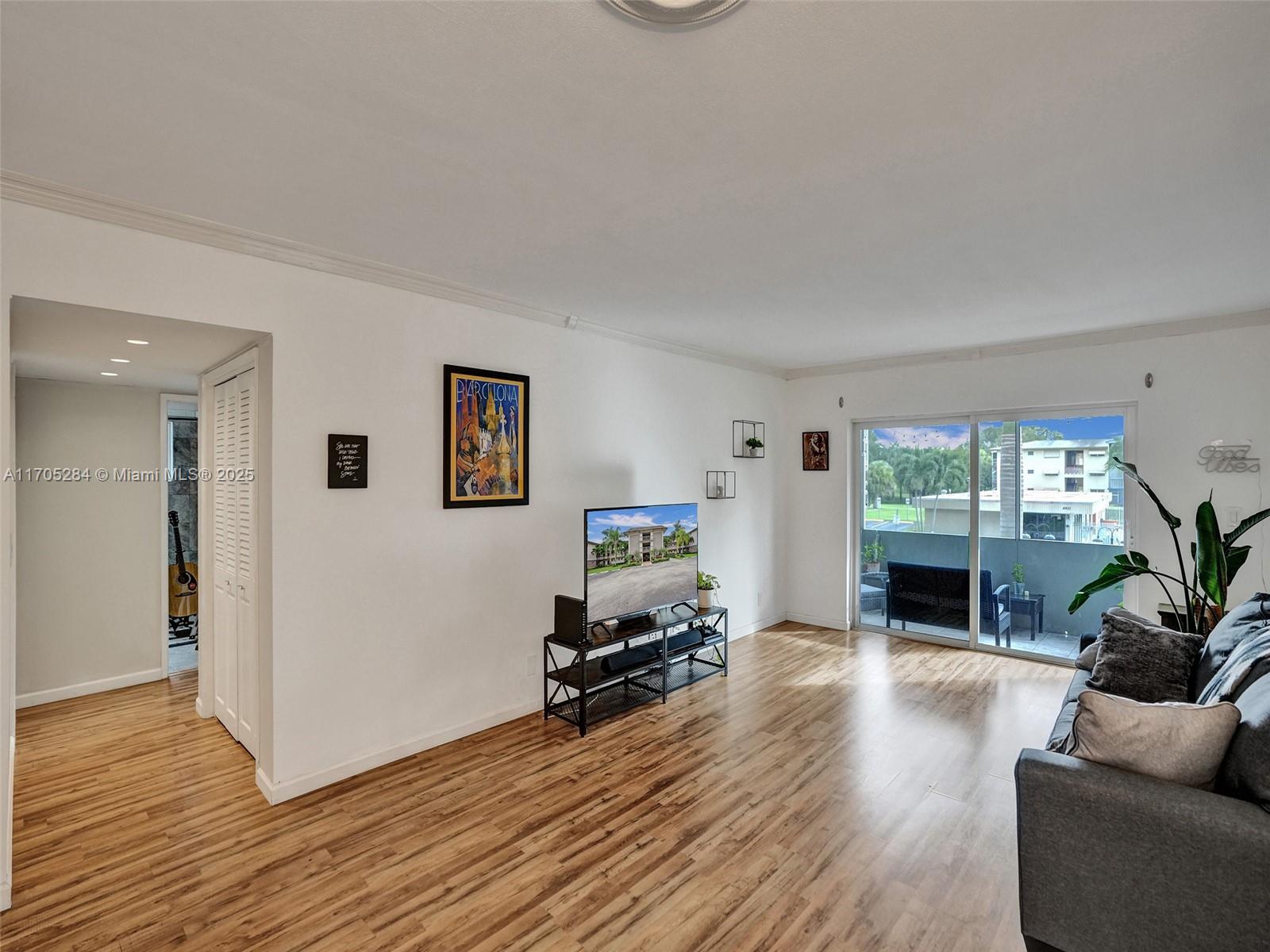Welcome to Hilcrest Country Club! This 2/2 corner unit built in 1994 is a true gem. Step into a bright and airy space flooded with natural light, showcasing the beauty of laminate floors throughout. The impact windows not only provide safety but also frame stunning views of the pool, creating a serene atmosphere. Plantation shutters add a touch of elegance, ensuring privacy when desired. The updated bathrooms and spacious walk-in closets enhance the functionality of this condo. ALL Ages, Owner Occupants only in this building! 1 assigned parking per unit and 2nd parking 50$ per month, Water & sewer included. Great location close to Turnpike, I-95, beaches, and Memorial Hospital. Envision yourself enjoying the south Florida living, This is a truly MUST SEE!!