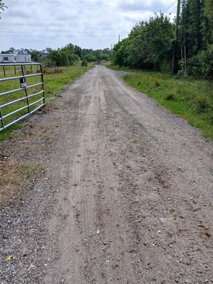 This Ranch sits on 5.04 acres, fully fenced and ready for your vision! Property features a double wide trailer, electric in place, and a brand-new artesian well capable of filling the large 6-9 ft deep pond in just one, perfect for swimming and water sports. Impact fees have already been paid, saving you time and money. Plenty of space to expand or build.